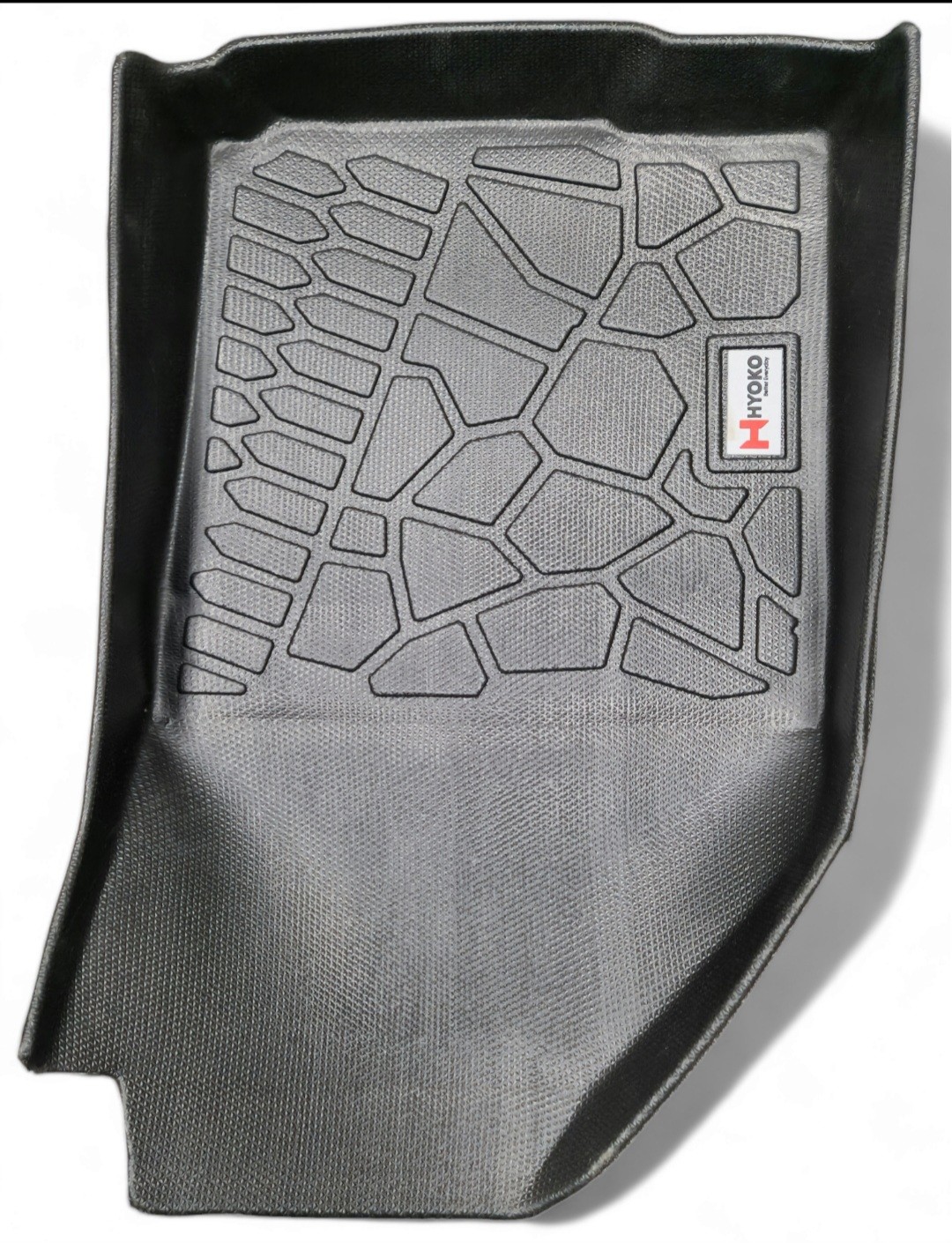 Black rubber floor mat with textured surface, featuring a grooved pattern for better grip and dirt retention.