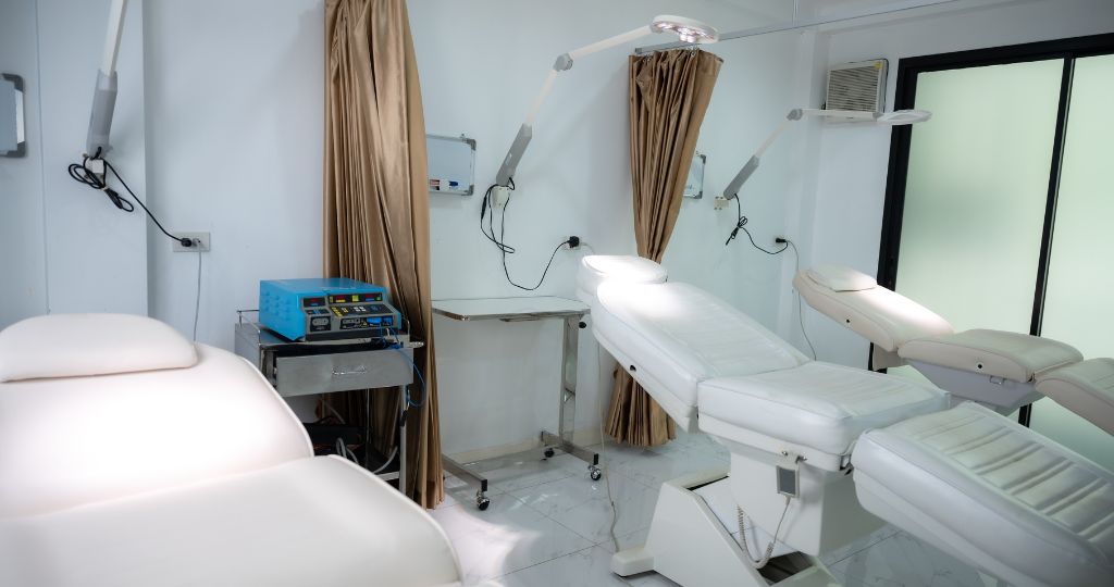 Interior of a cosmetic surgery clinic with treatment chairs and medical equipment