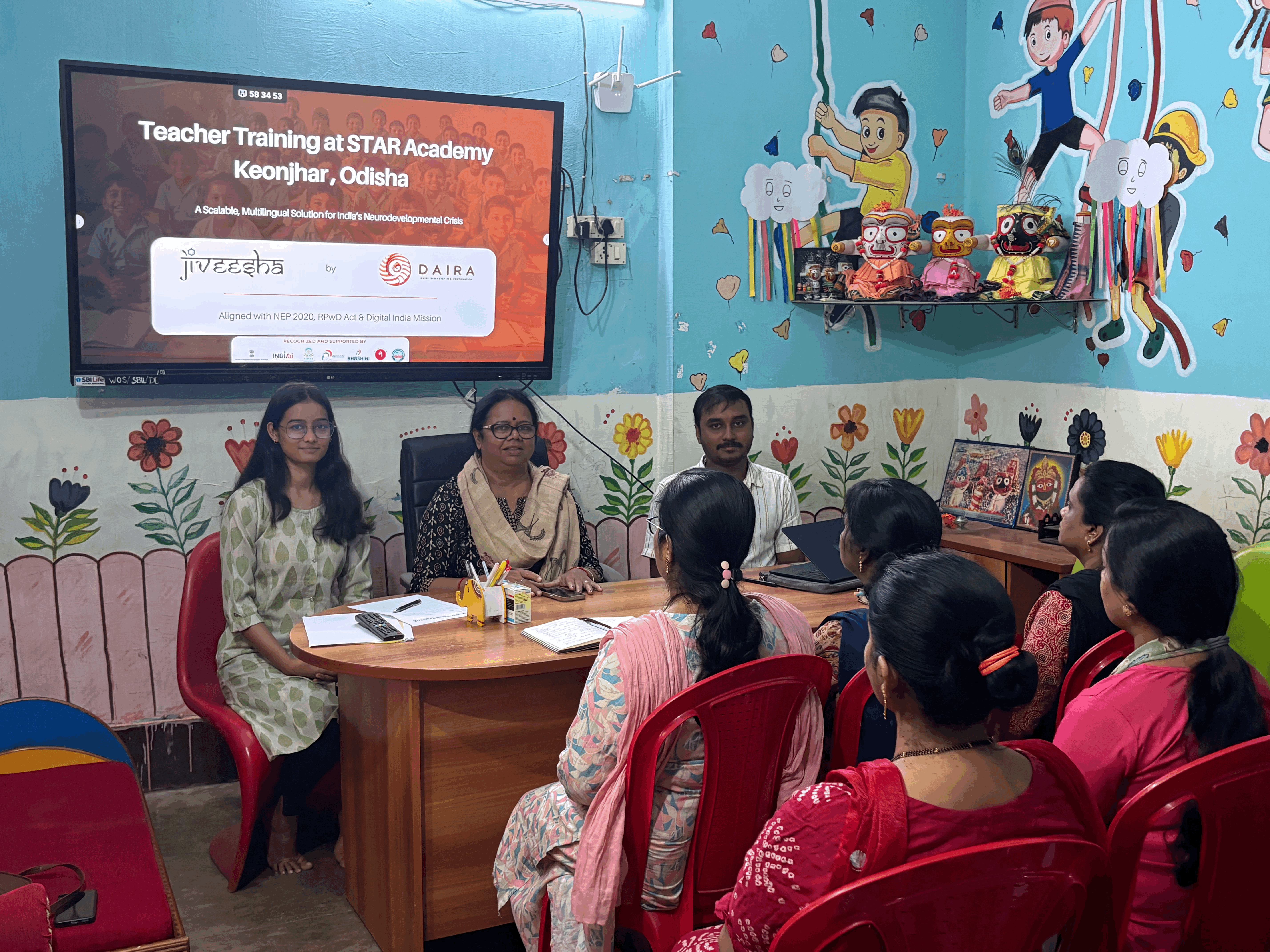 person in gray hoodie holding red and white box