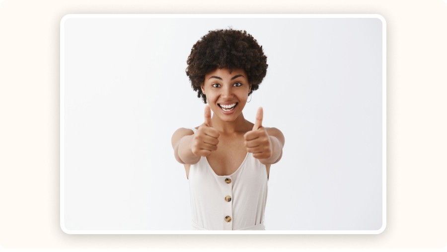 Happy woman giving two thumbs up
