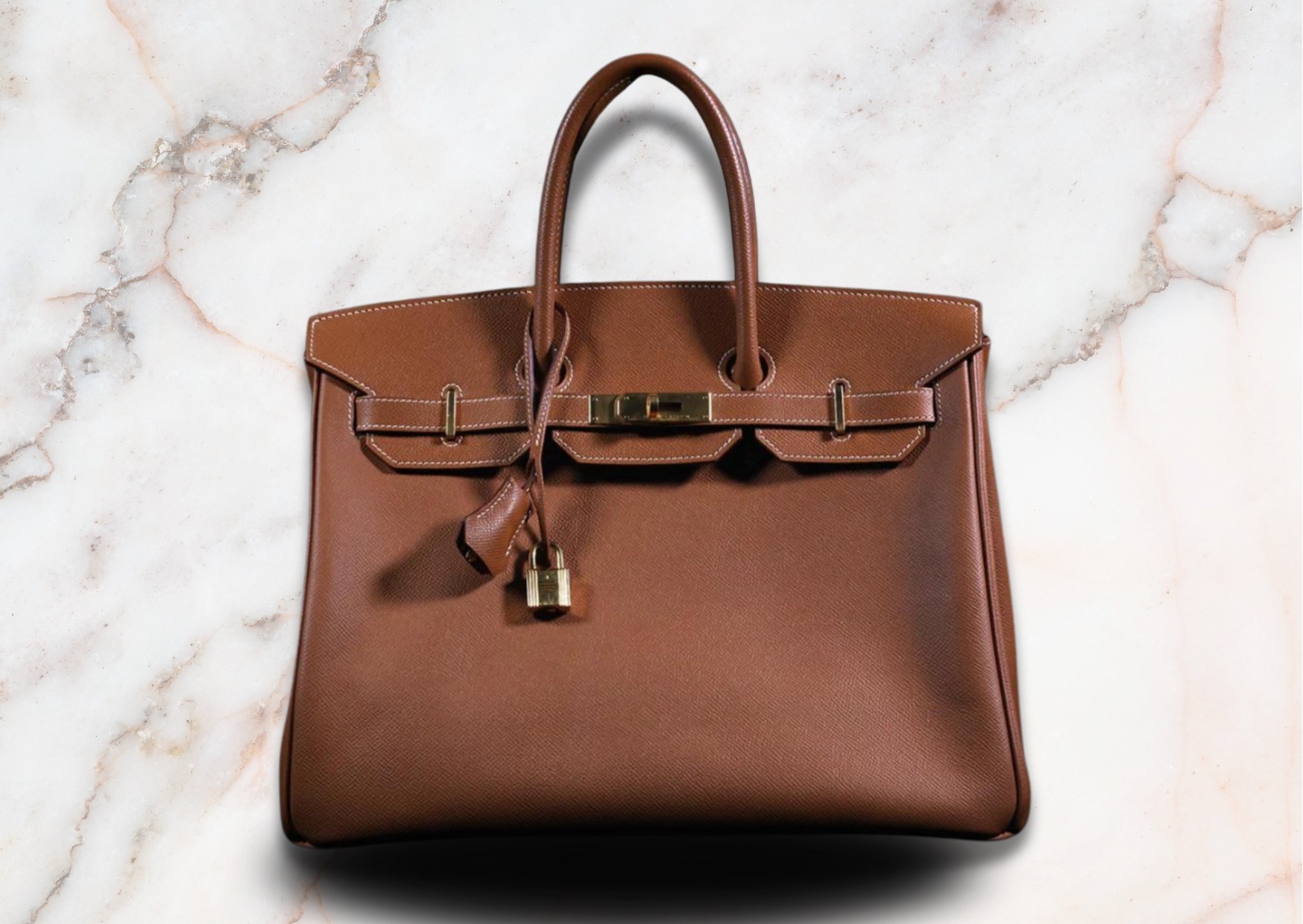 Luxurious Hermes Birkin bag crafted from fine, high quality brown leather, exuding elegance and timeless beauty / appeal.