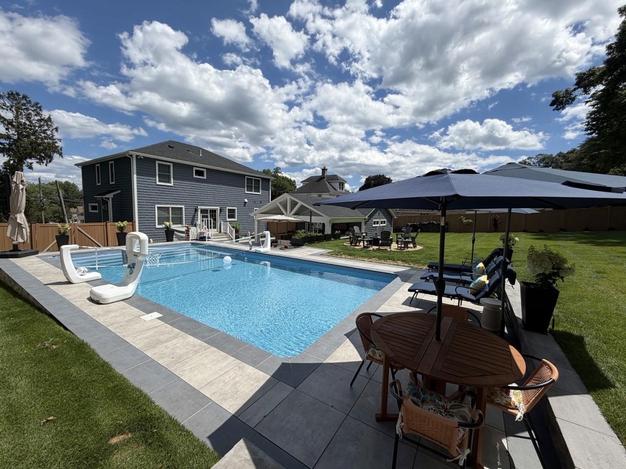 Custom poolscape and backyard renovation by CMC Masonry