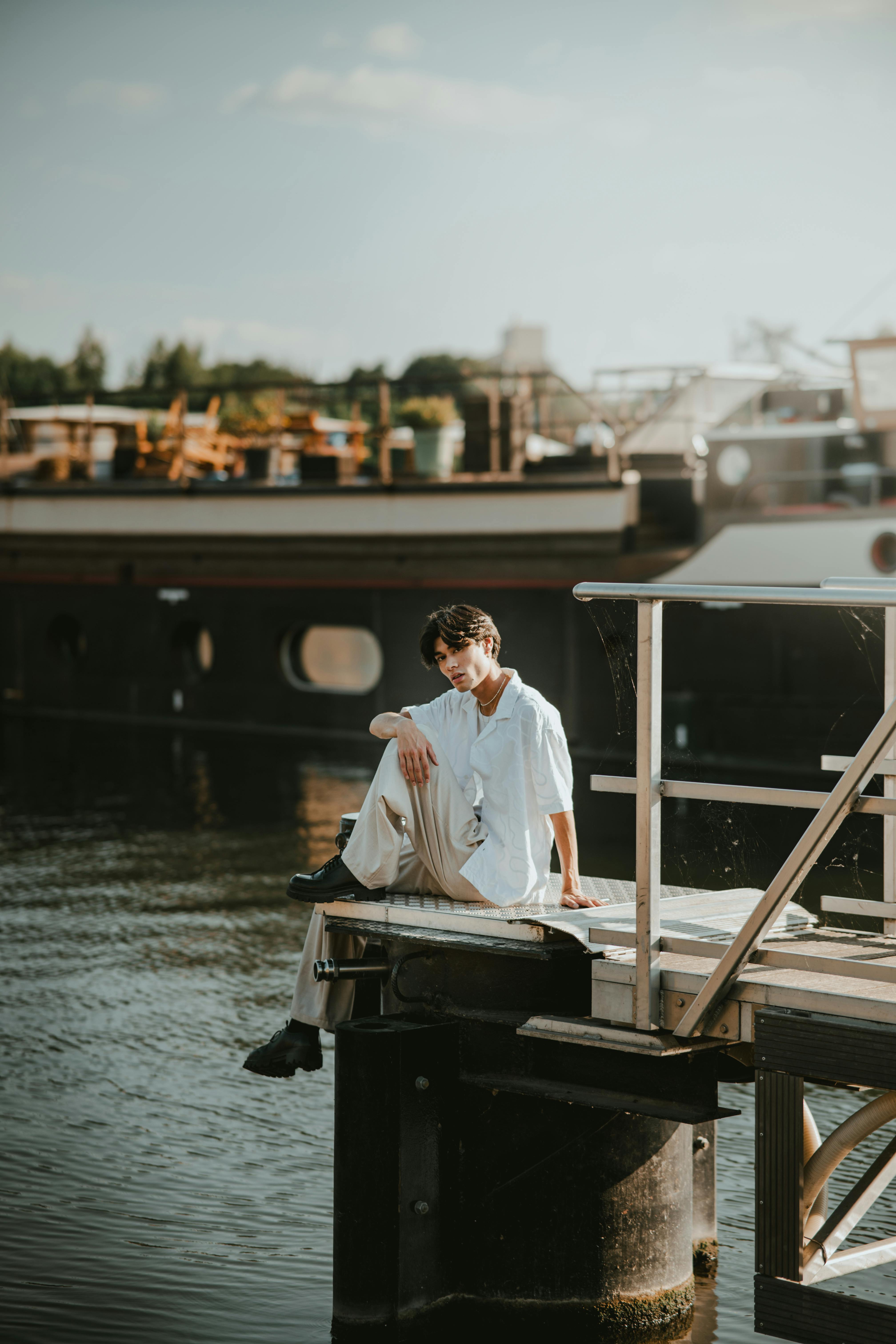 A man getting his hair cut by a woman
