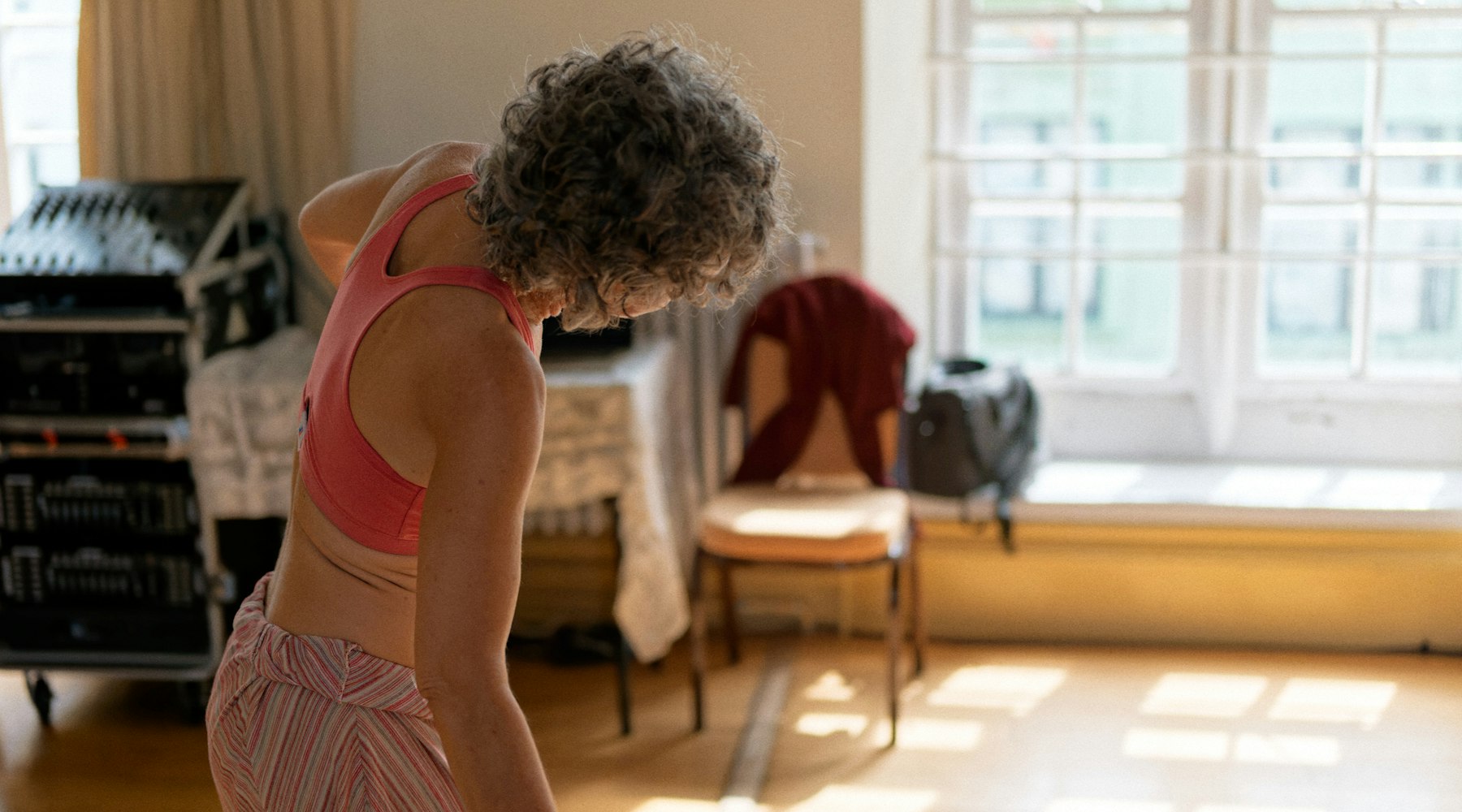 Woman in her fifties exercising at home