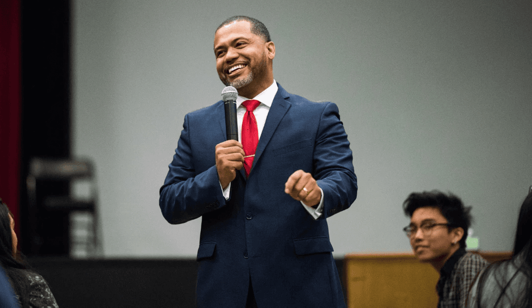 A speaker addressing an audience at a live event