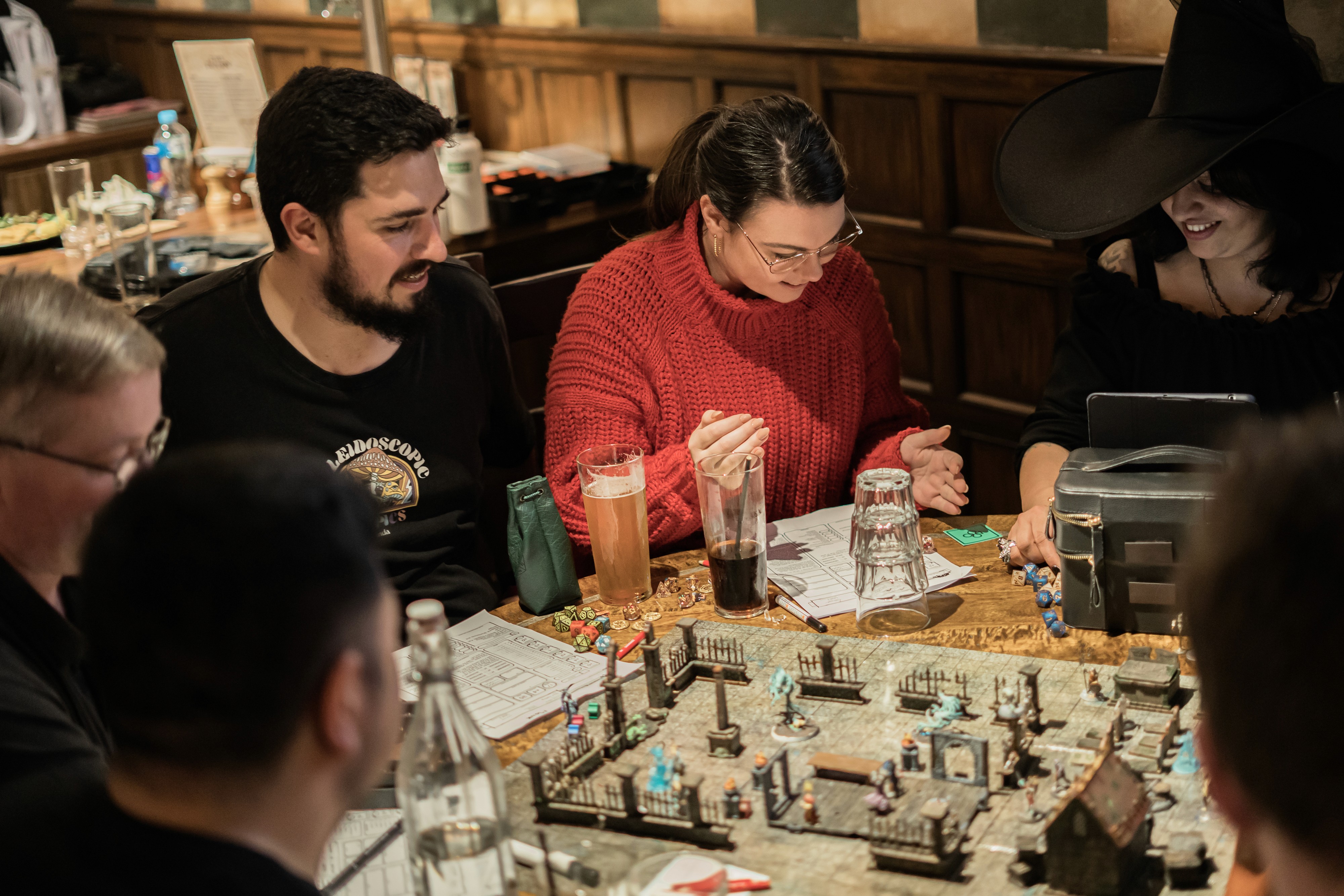 Dungeon Master explaining a part of the story to a group of players at Fortress Games