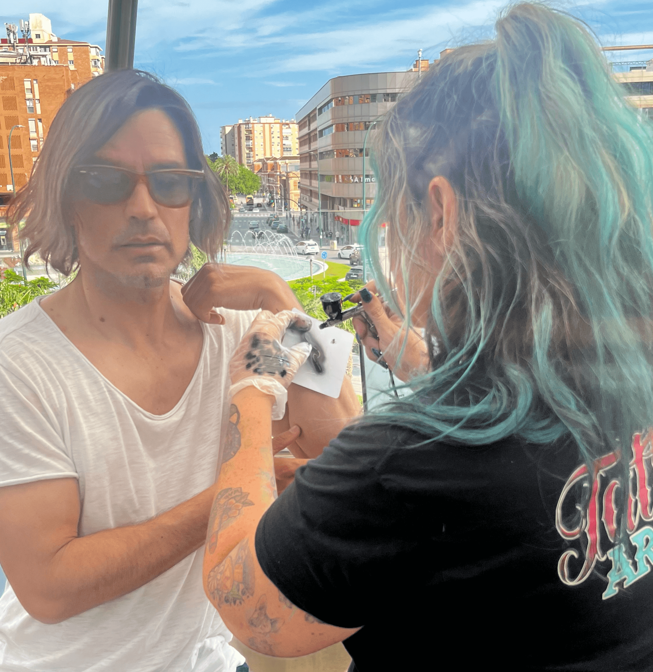 A lone astronaut sitting on a rocky surface, gazing at Earth from space.