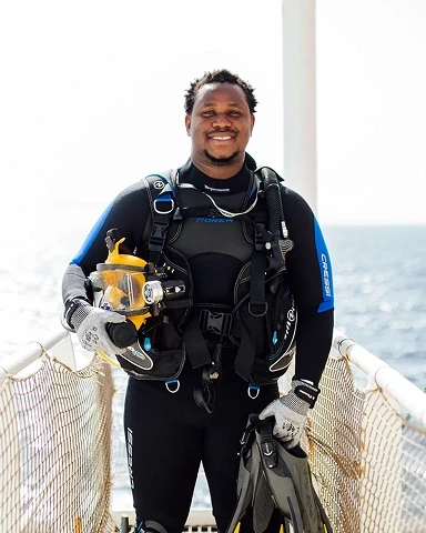 Volunteer in a scuba diving suit