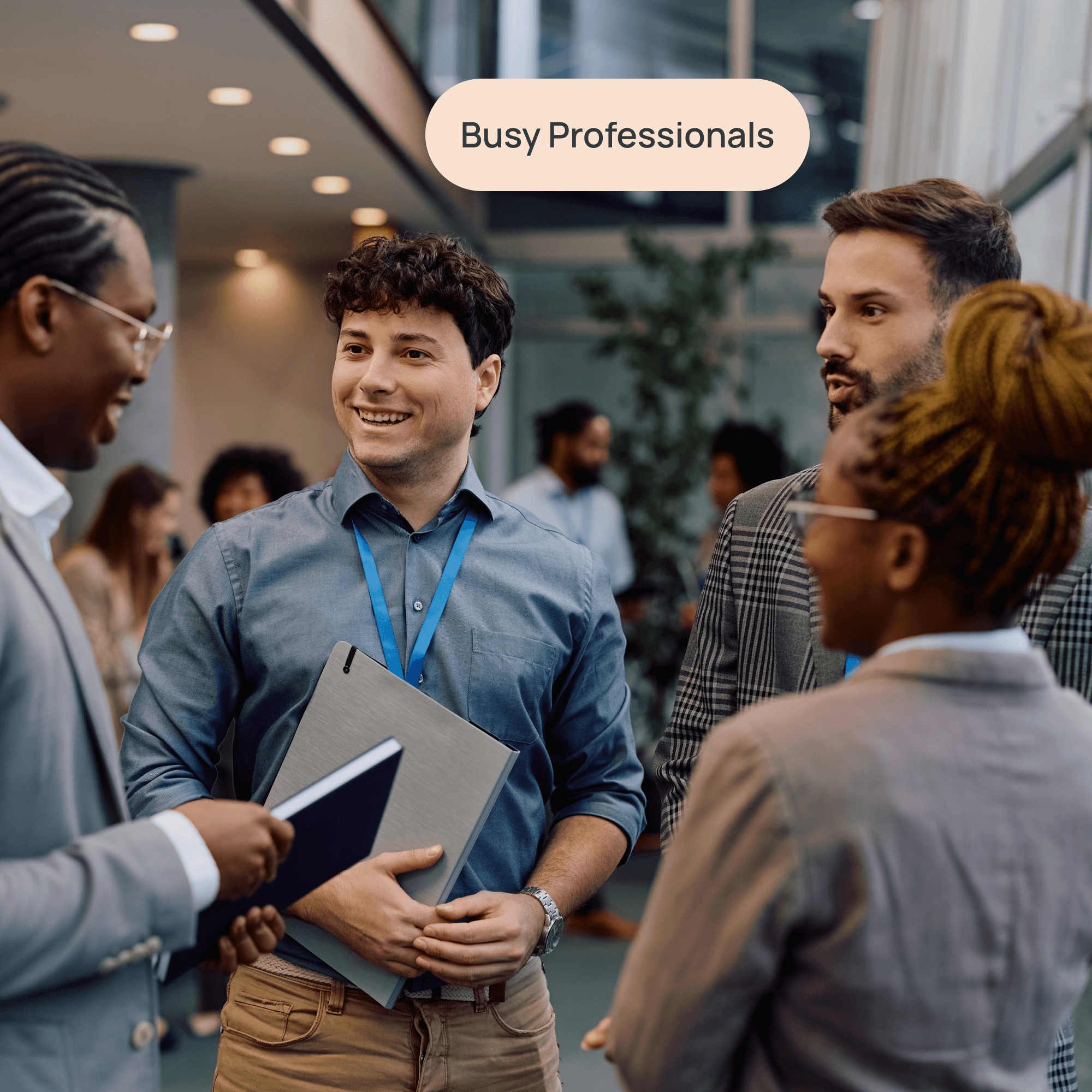 Group of young professionals talking with label "busy professionals"