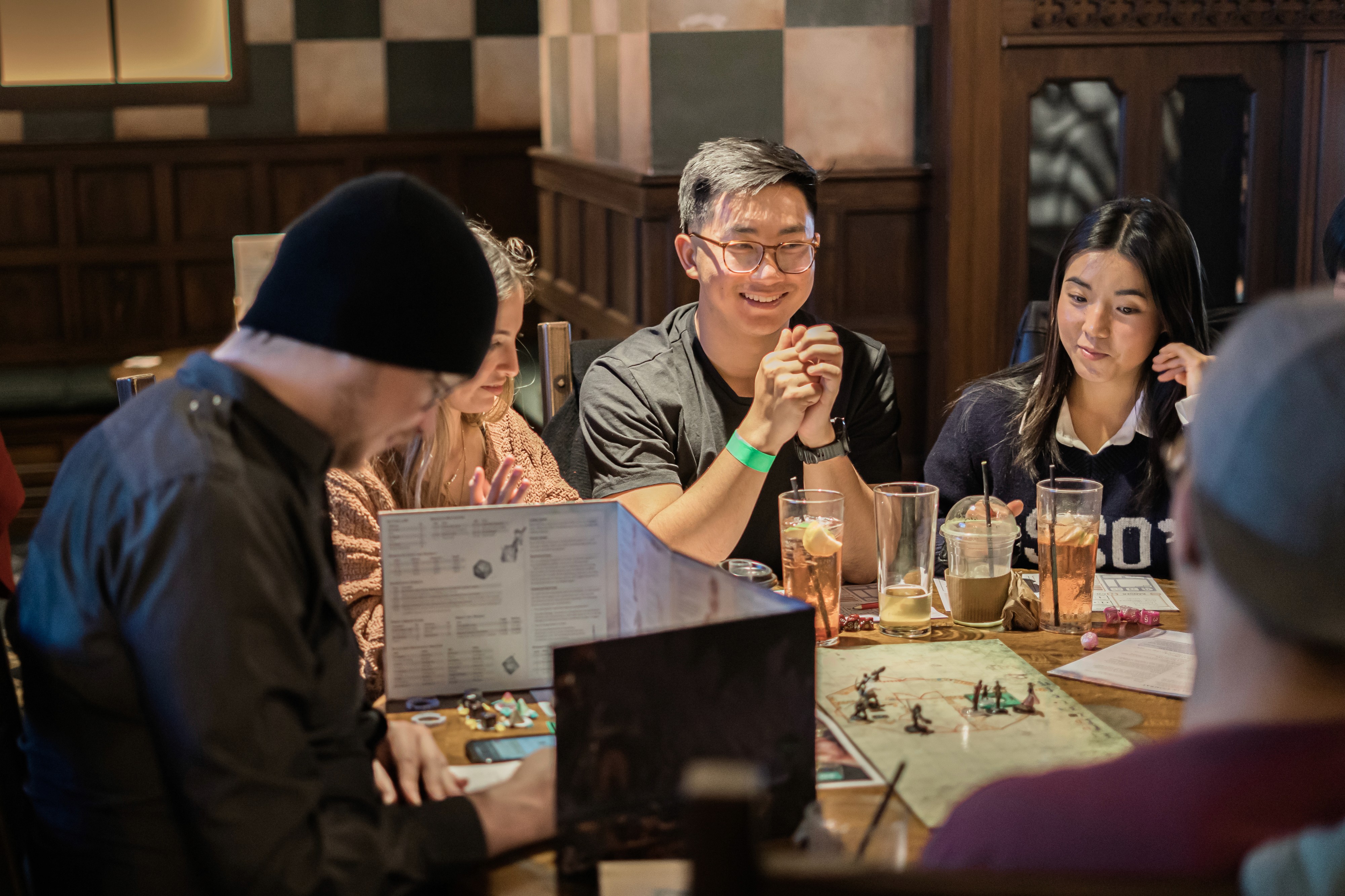 Dungeon Master explaining a part of the story to a group of players at Fortress Games