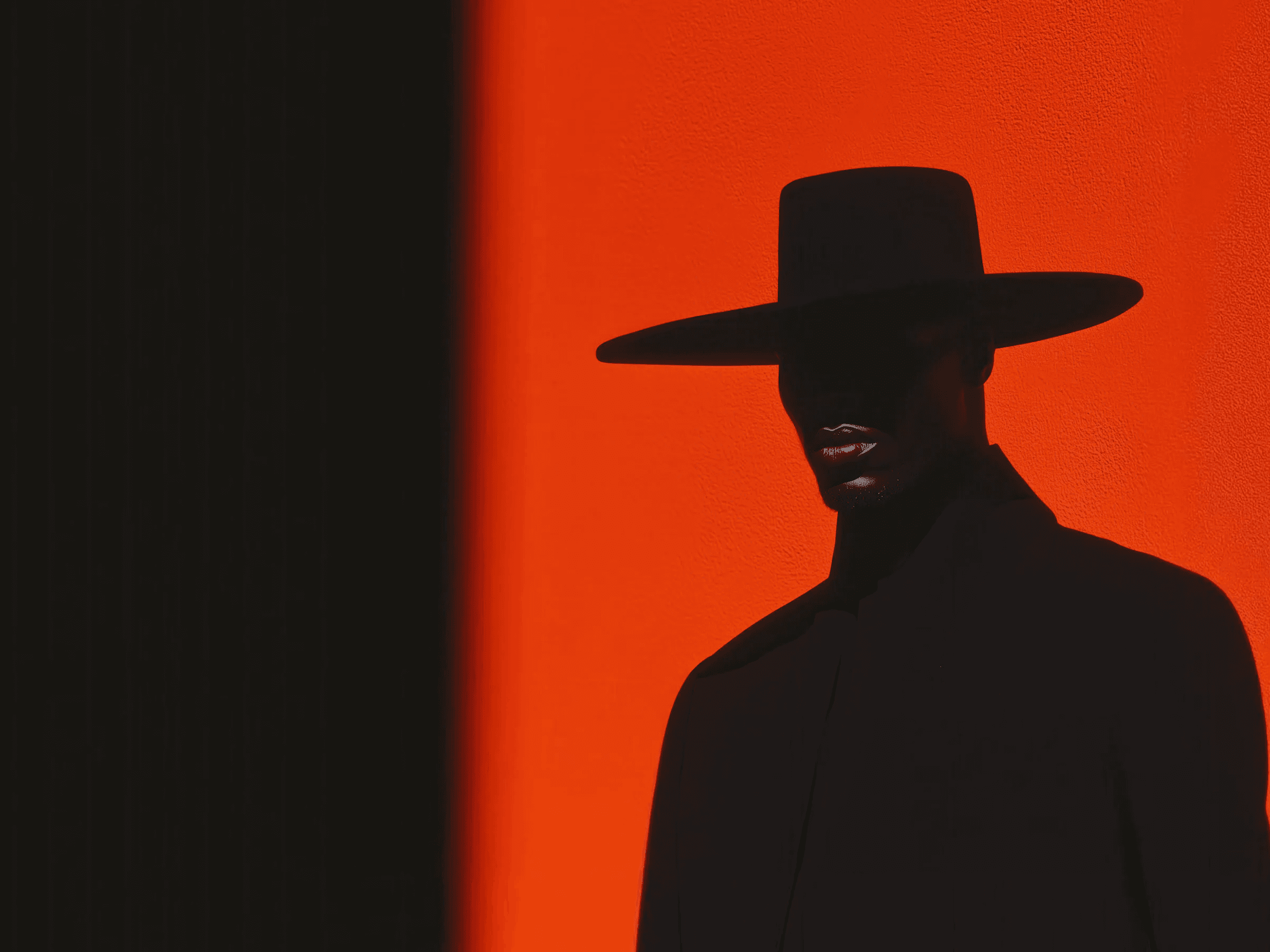 A man wearing hat in dark