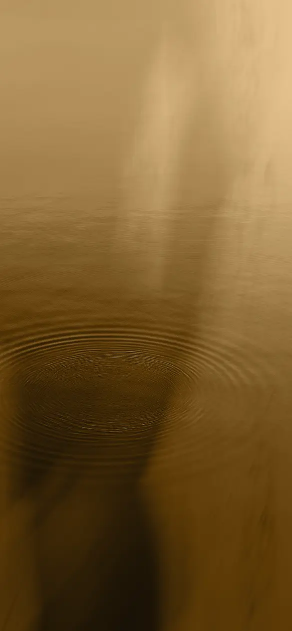 A serene body of water with gentle ripples creating a calm and meditative atmosphere, ideal for a peaceful wellness and spa experience.