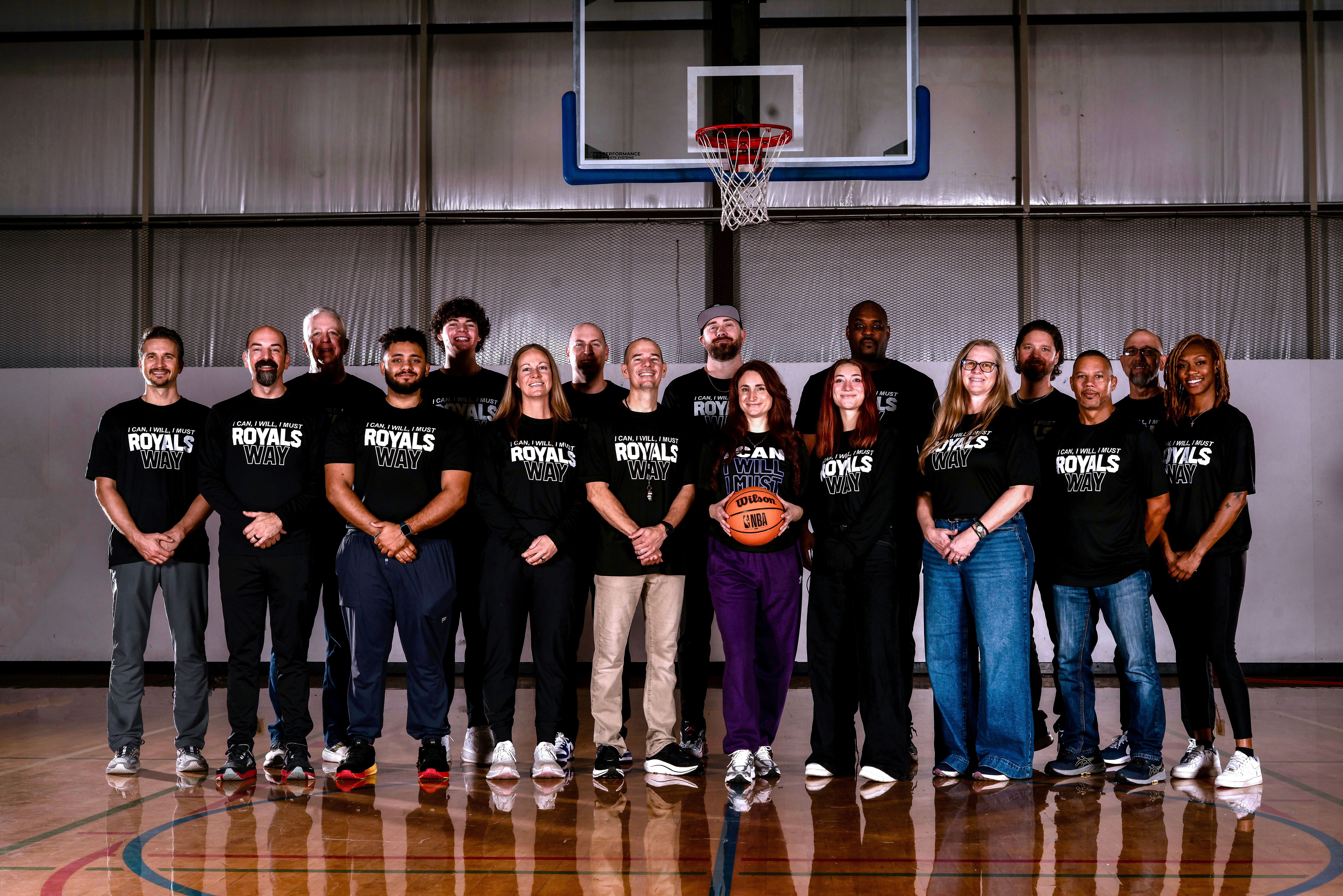 Rachel, personal trainer, looking to the side confidently in a fitness studio