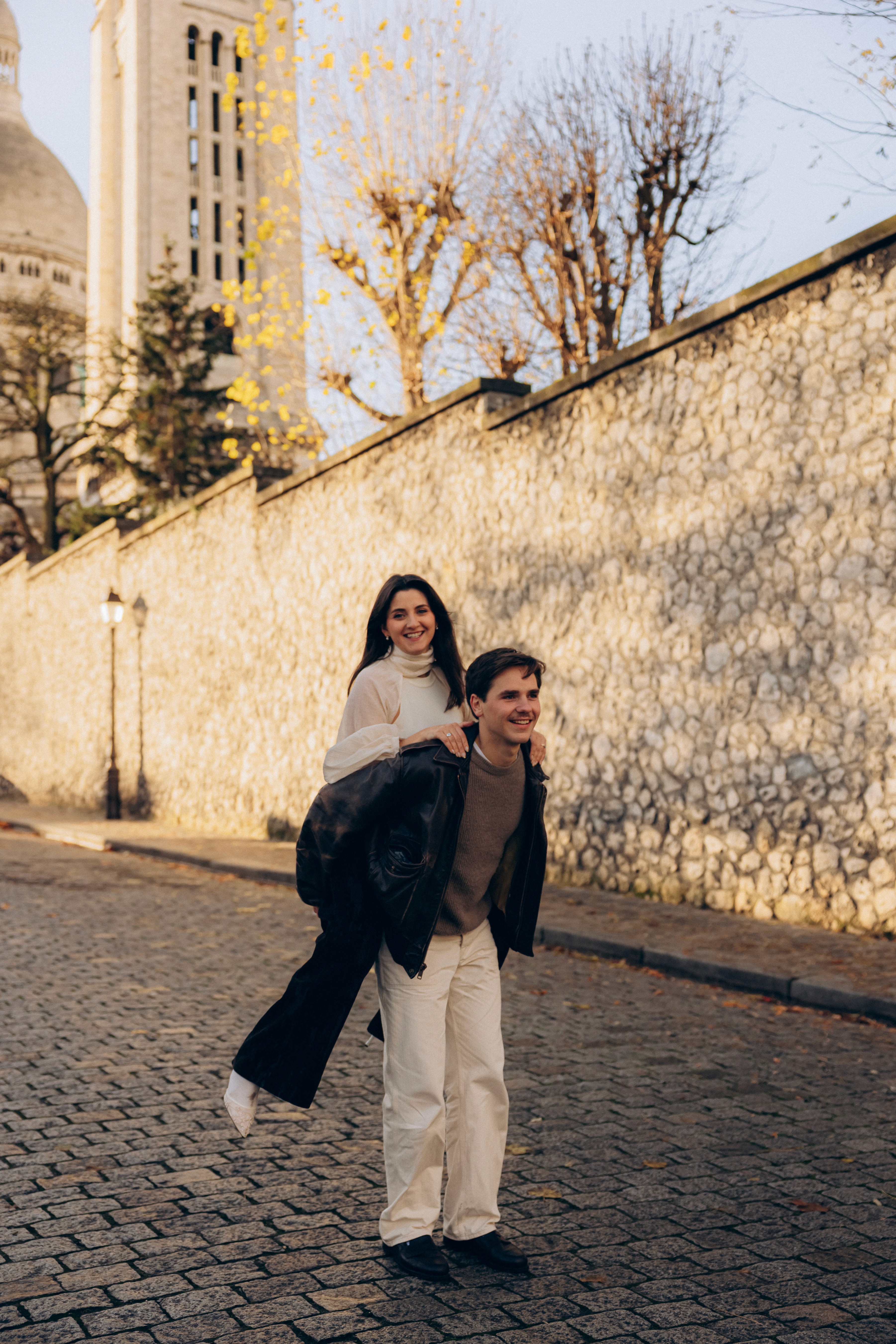 Couple portrait with dog on field