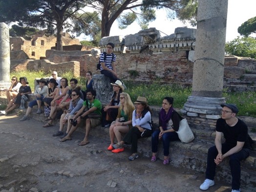 group sitting at the stone bench