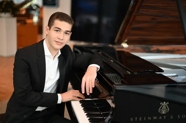 Brandon Goldberg sitting at the piano.