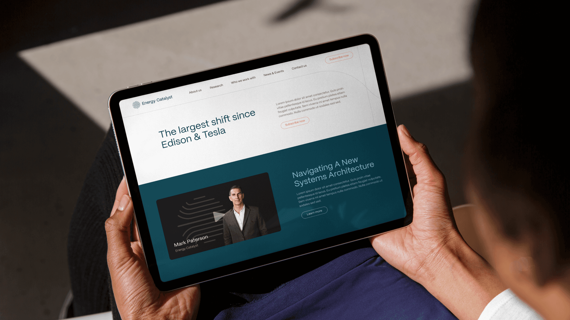 Man holding laptop with homepage design