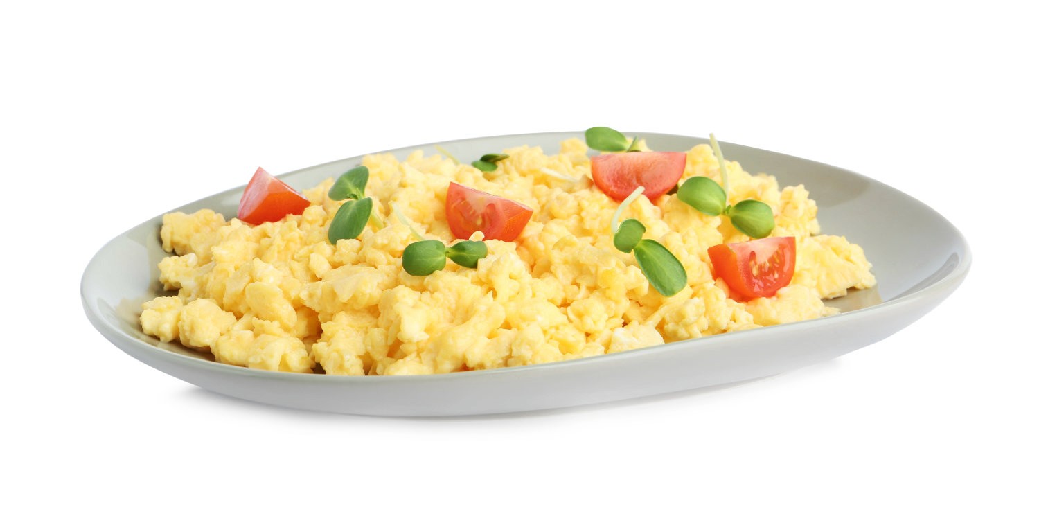 Scrambled Eggs Topped With Tomato and Sprouts