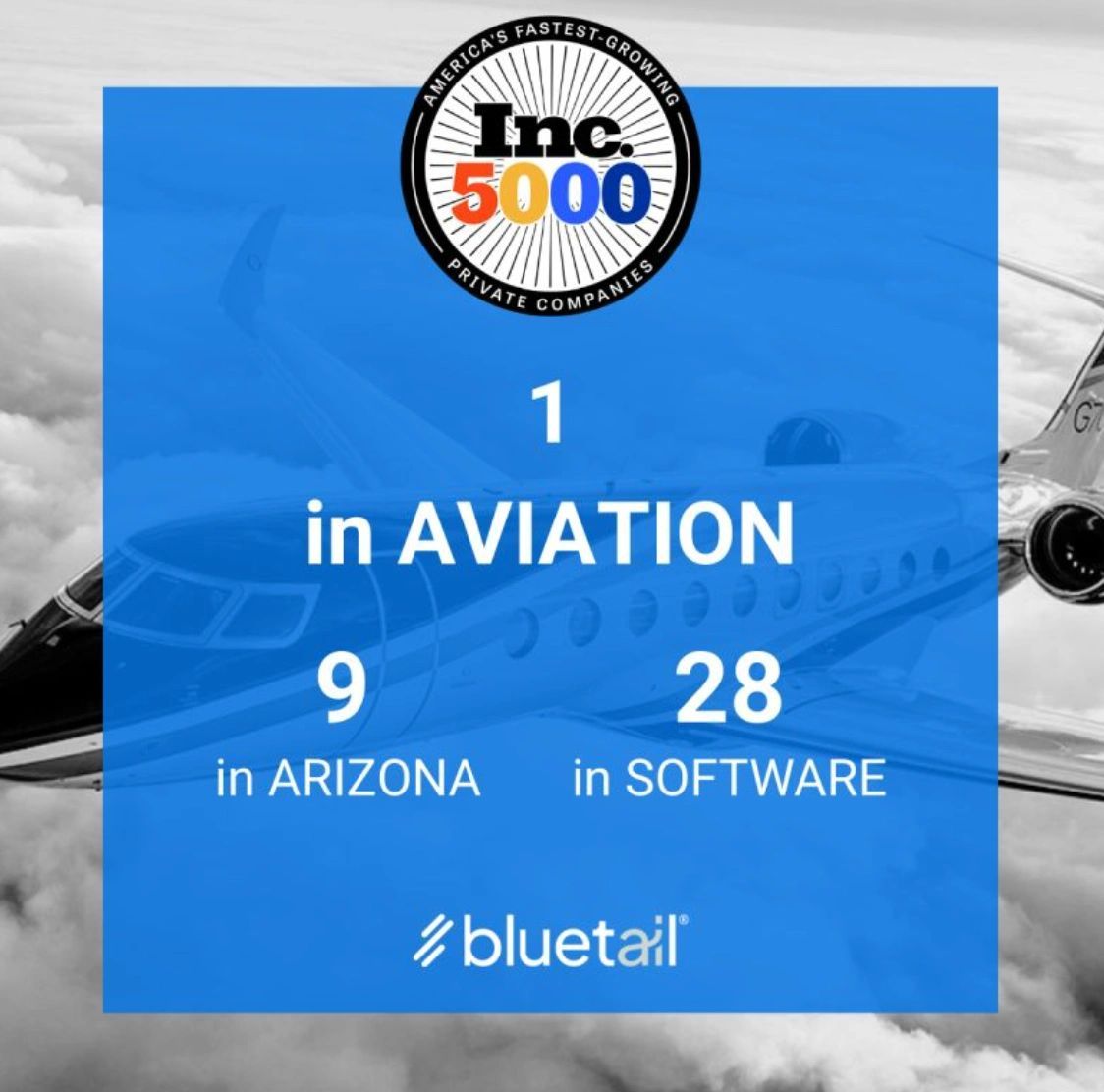 a black and white living room with a large tv