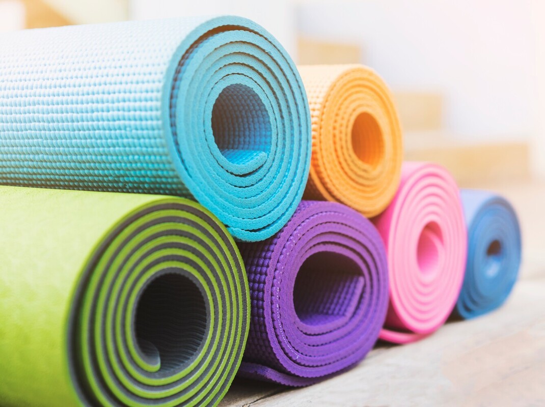 collection of colorful exercise mats that can be used for all of the best at-home exercises to lose weight