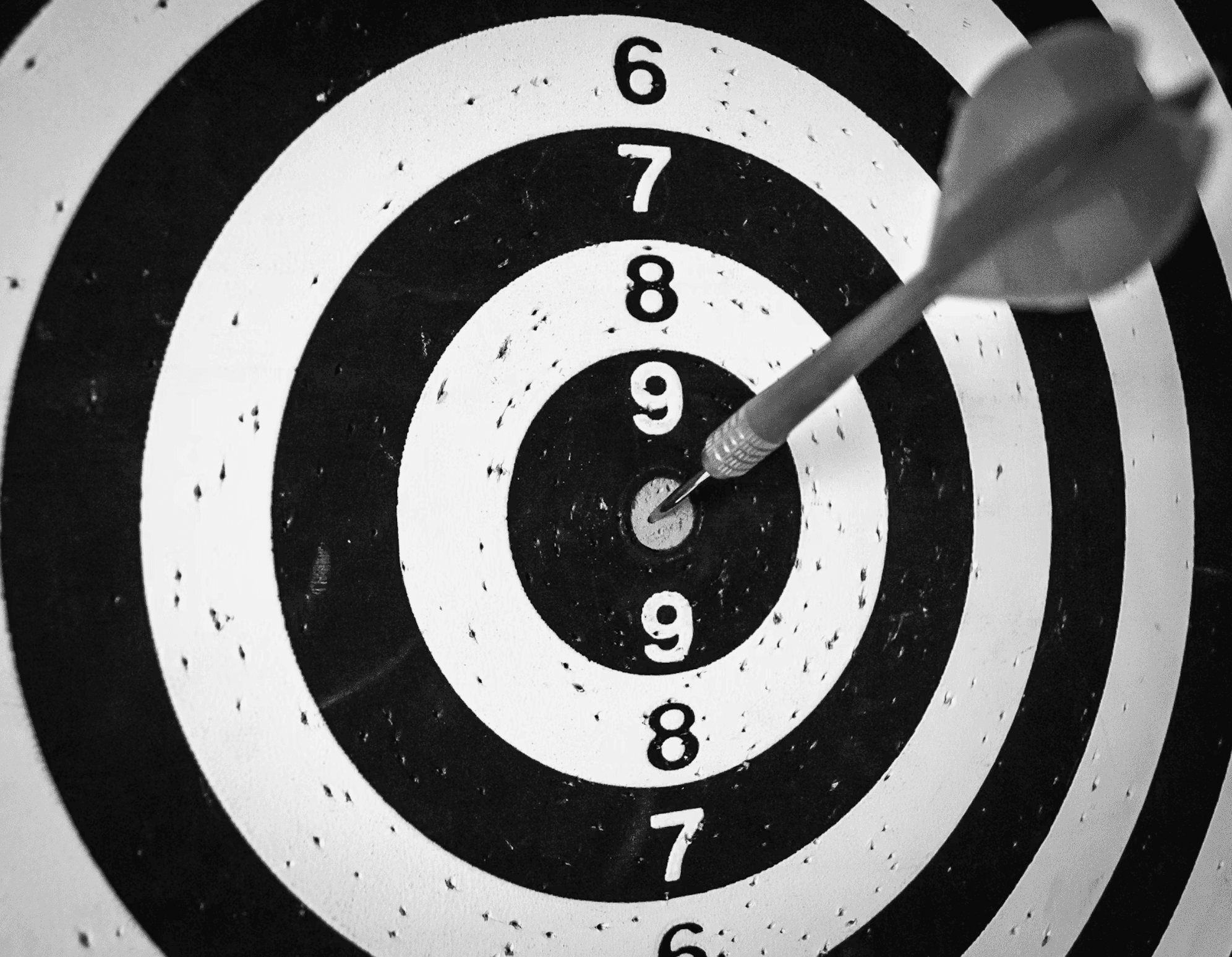 Black and White image of a dart board with a bullseye