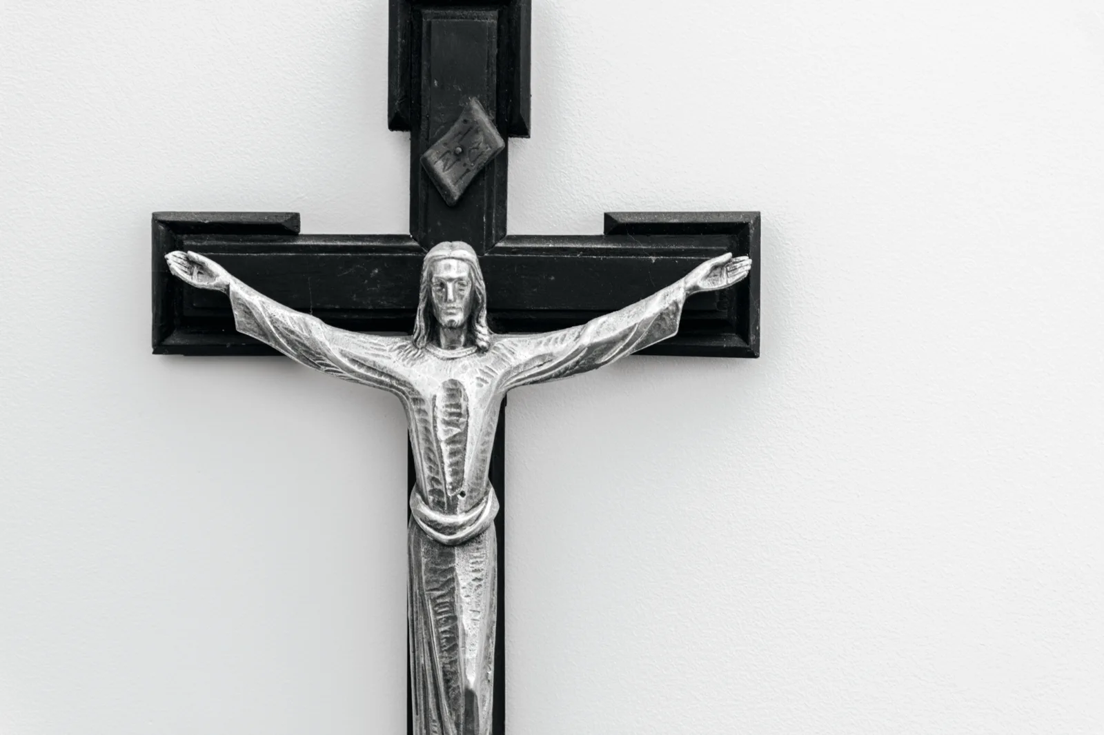 Metal crucifix mounted on a wall
