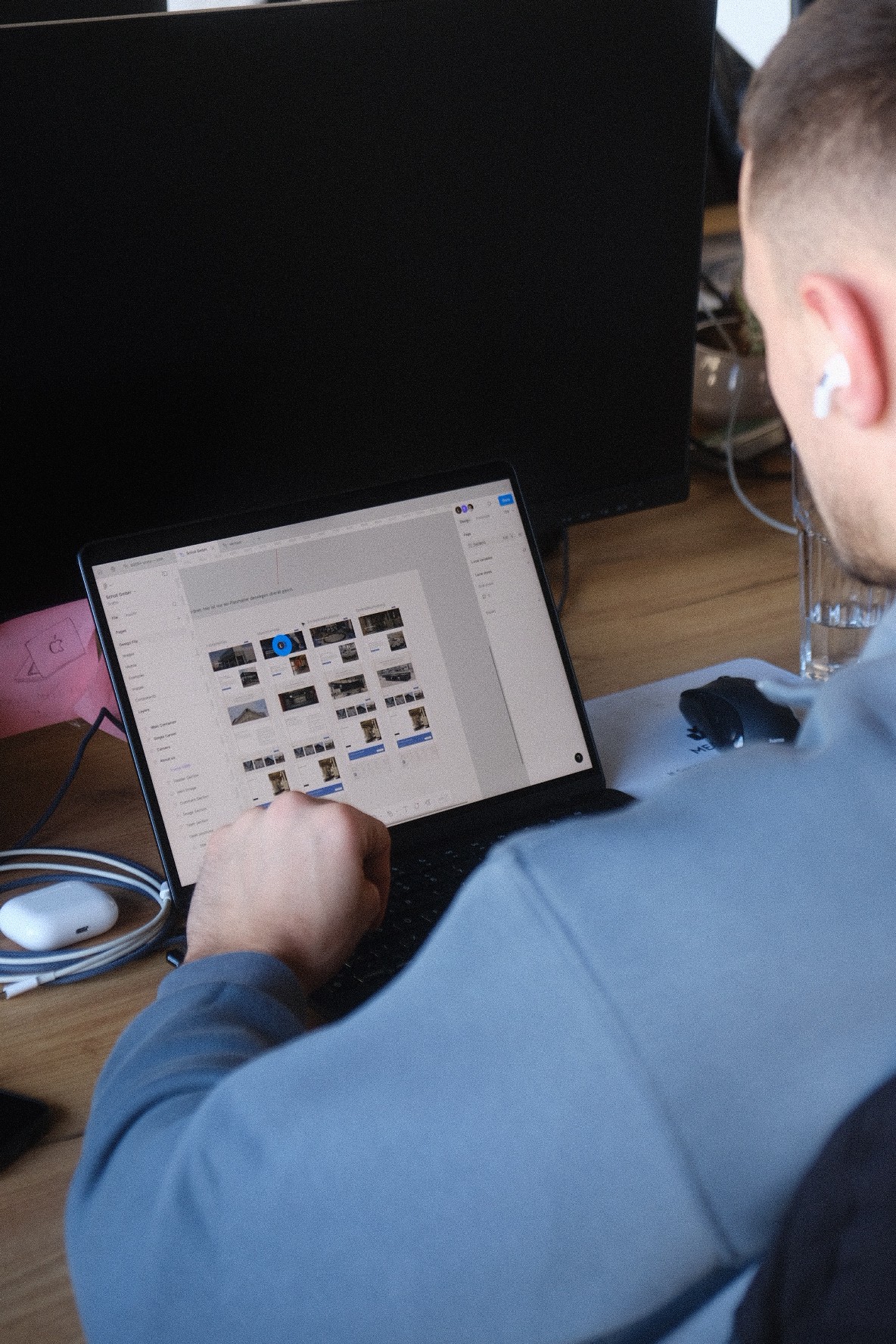 A close-up of a beige-colored laptop with a smooth, matte finish on a matching surface.