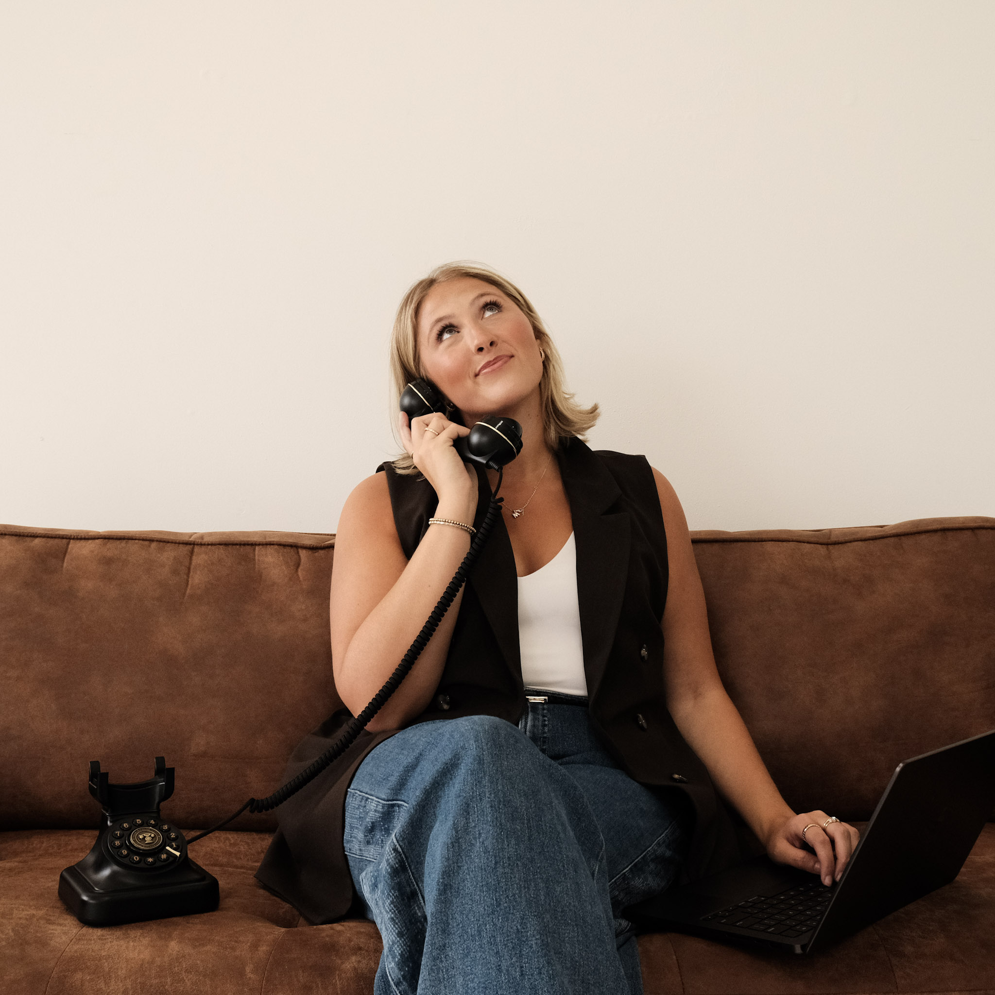 Creative director on the phone with client listening to their needs and wants intently