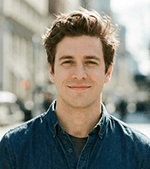 man wearing Lacoste zip-up hooded top