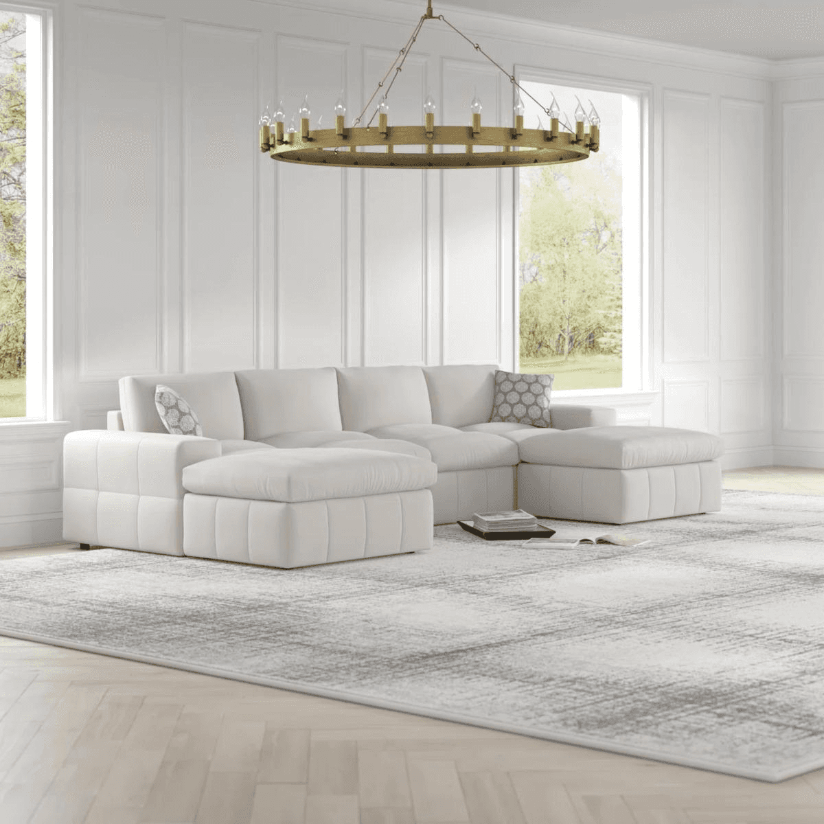 Grayleigh Anchoretta white 6-piece upholstered sectional sofa in an elegant living room with white walls & large window.