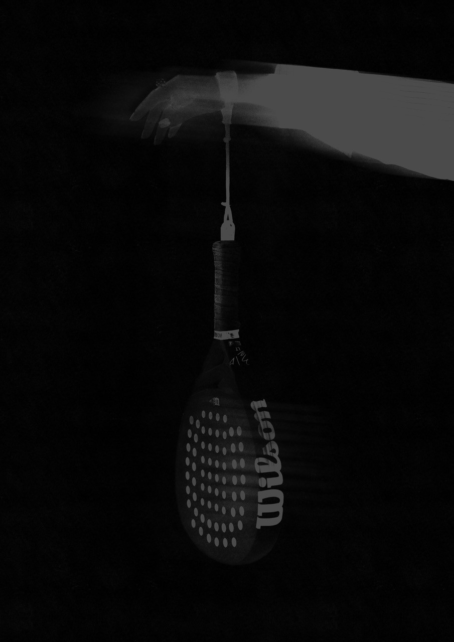 two tennis rackets and balls on a blue tennis court