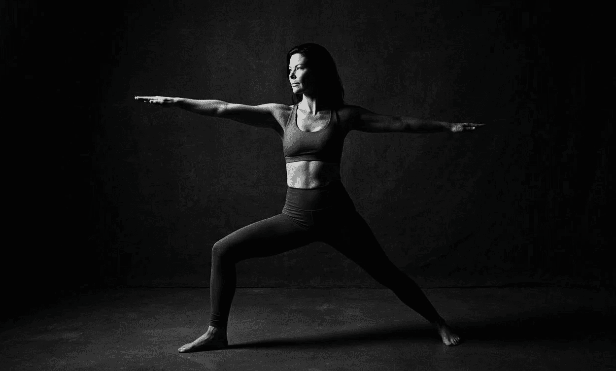 woman in warrior yoga pose