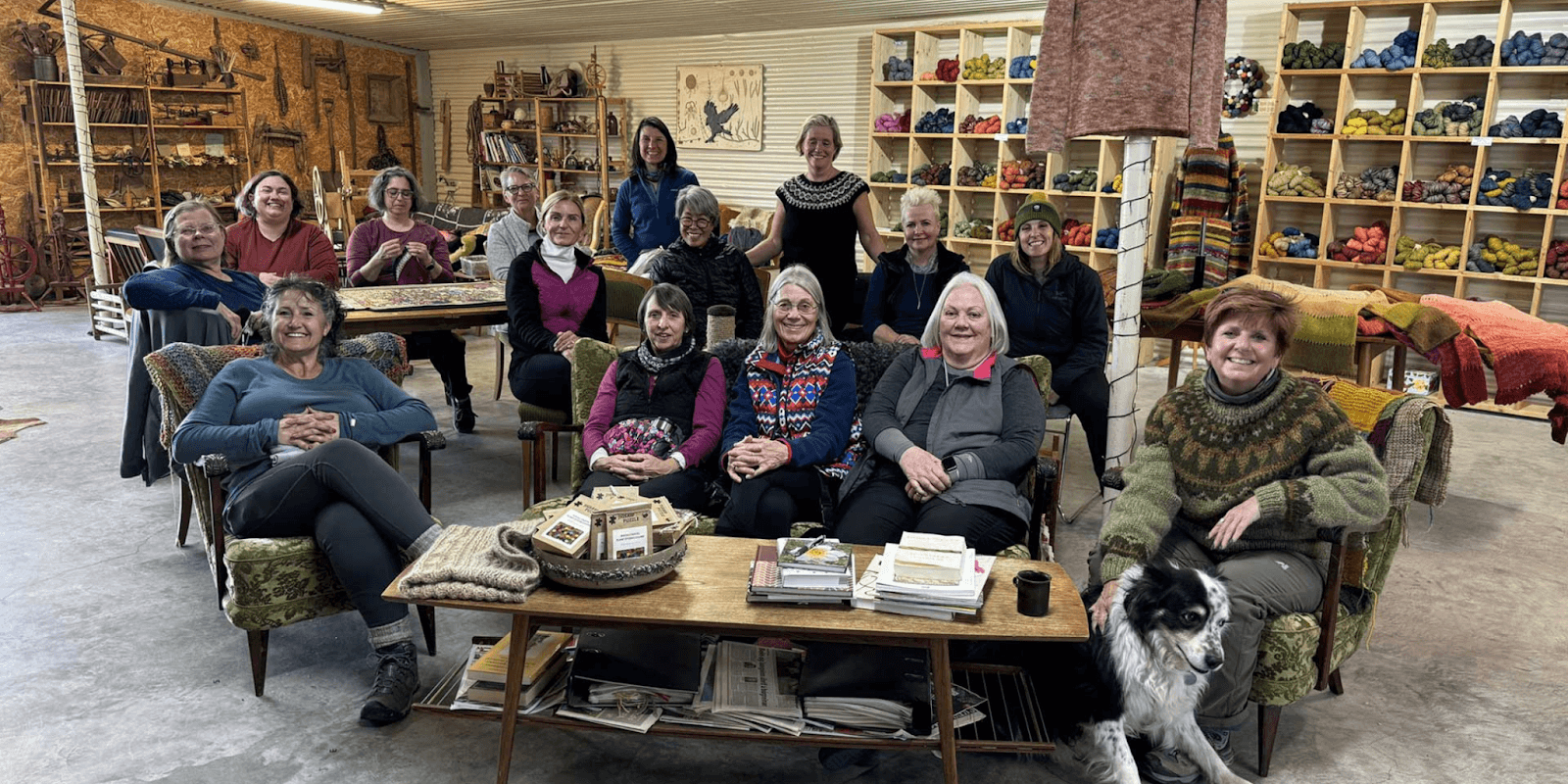 A group of women enjoying an Icelandic knitting retreat, surrounded by yarn and cozy surroundings.