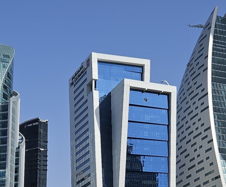 Modern architecture of The Exchange Tower. Professional real estate services for Business Bay commercial properties.