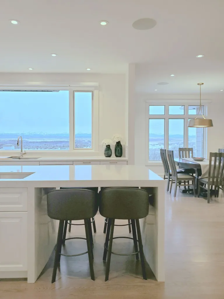 Image of KHD Homes kitchen design with island seating, furniture, and modern layout for home renovations and design-build.