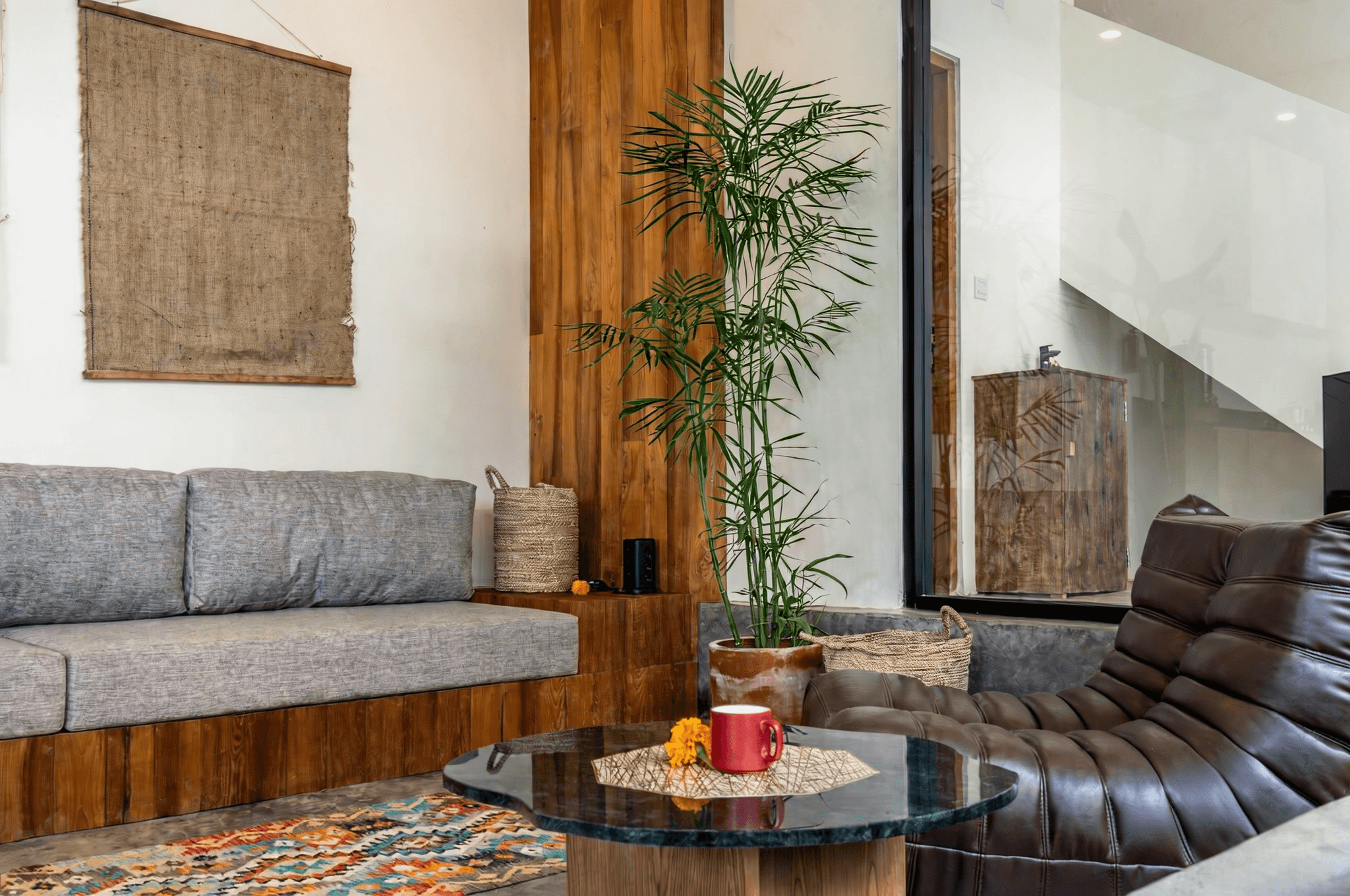 Cozy living area with wooden accents. Real estate agent services for stylish and authentic Kerobokan homes.