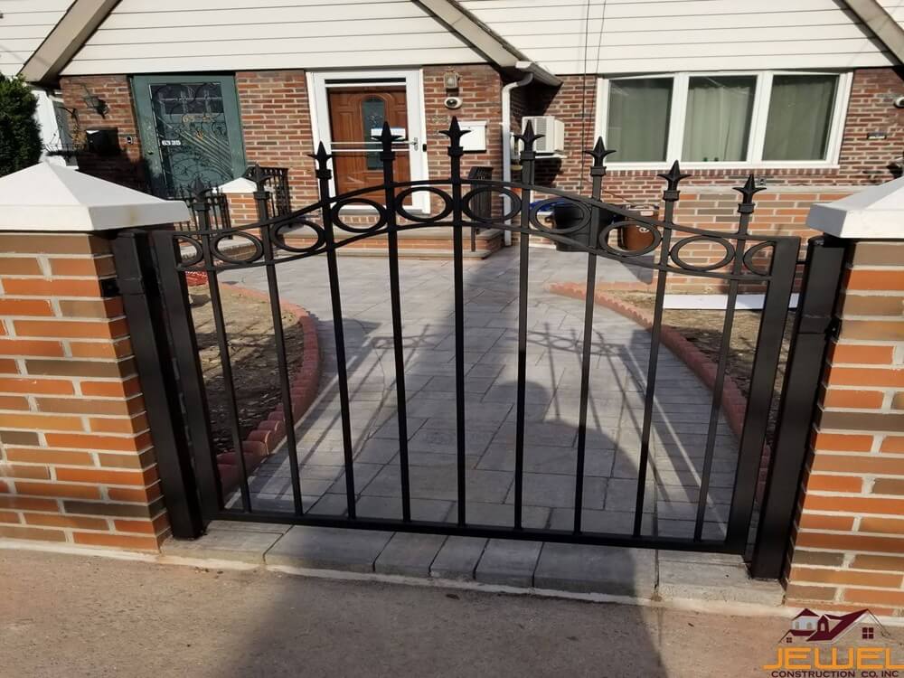 Custom brickwork with Capping lime stone and custom iron fence for school completed by Jewel Construction in Queens, NYC