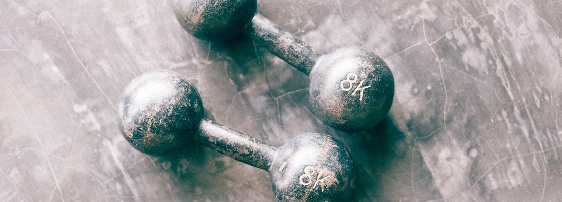 a pair of old modeled dumbells