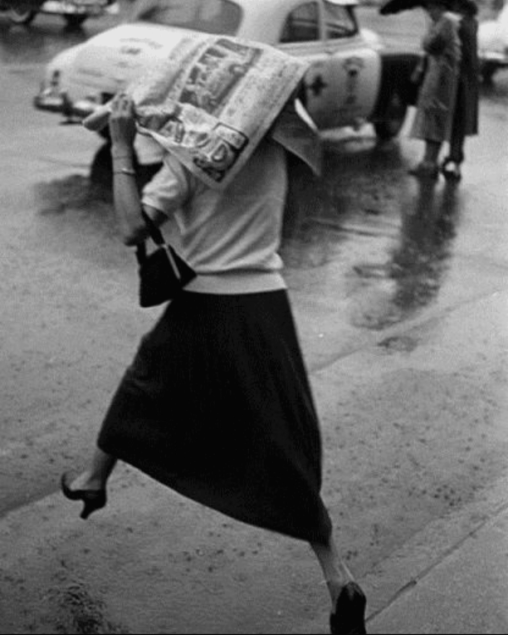 View of the French countryside through a stone villa’s open living room, with sofas and trees framing the scene