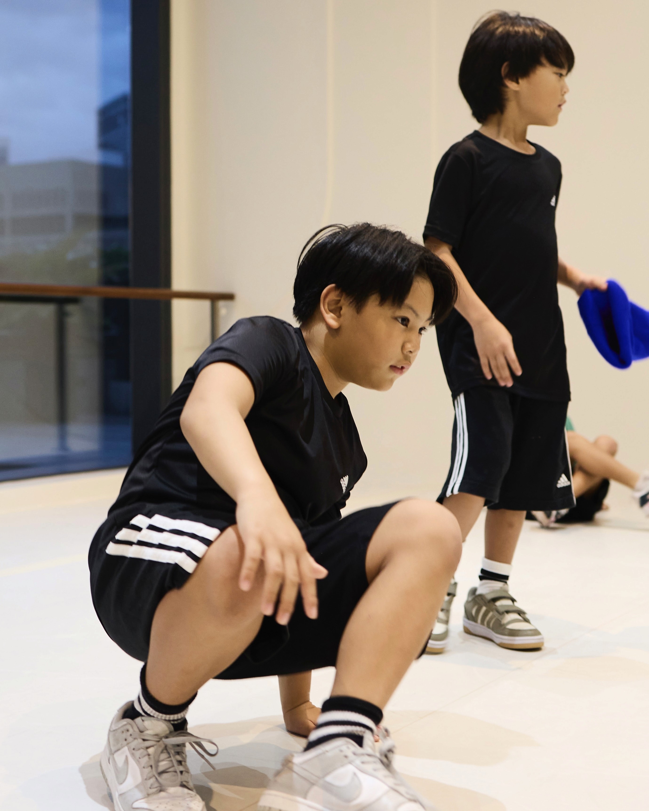 teacher teaching kid breakdancing in BGC Taguig