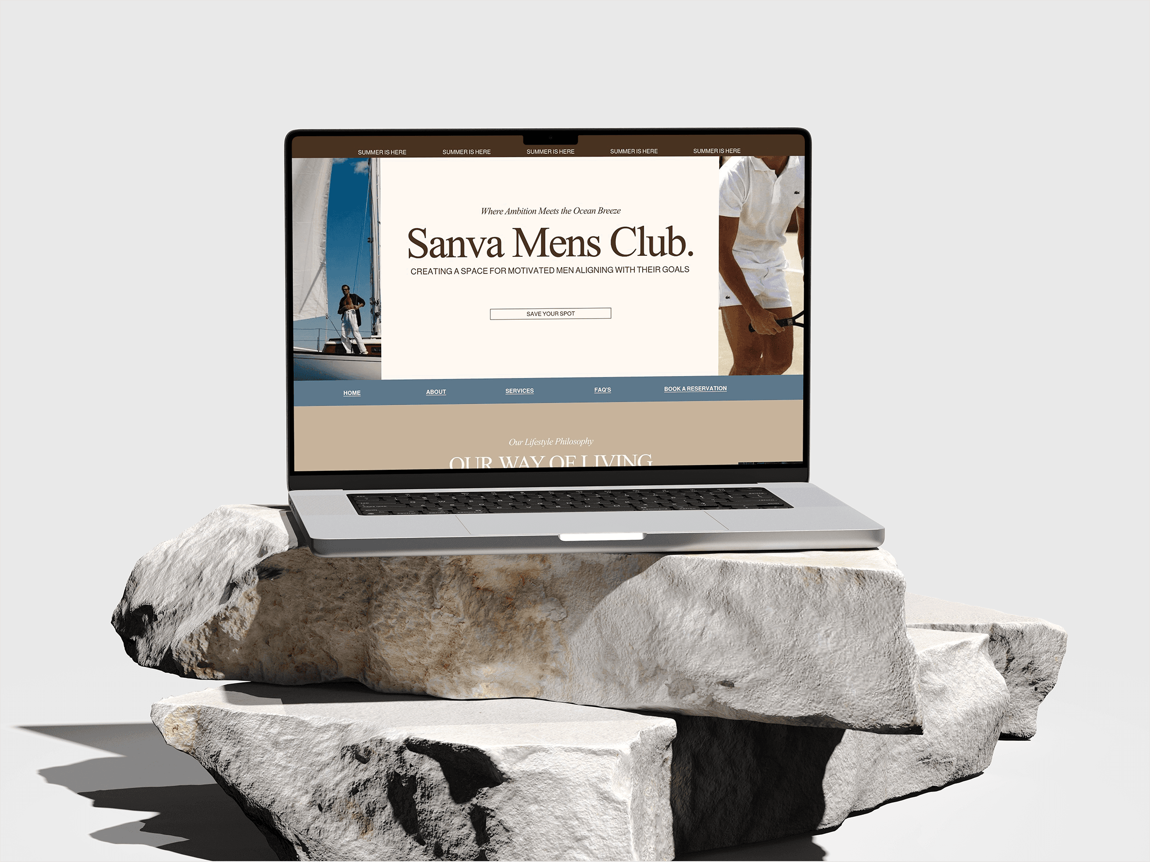 A computer standing in rocks with a website on the screen