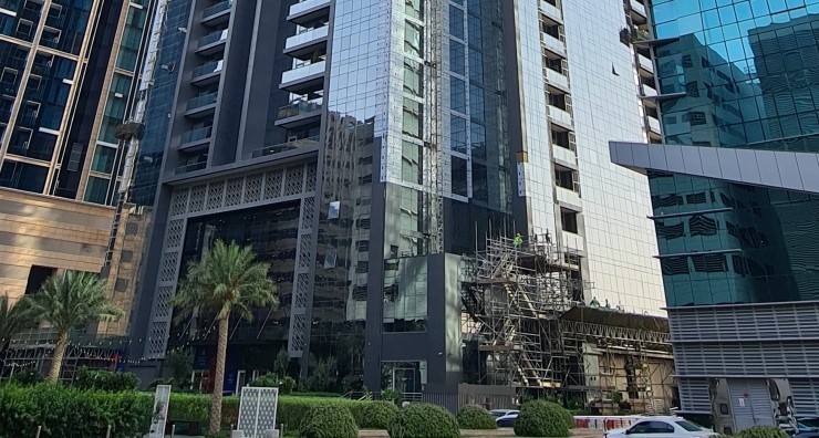 Modern exterior of Duja Tower showcasing contemporary architecture and glass facade in a prime location.