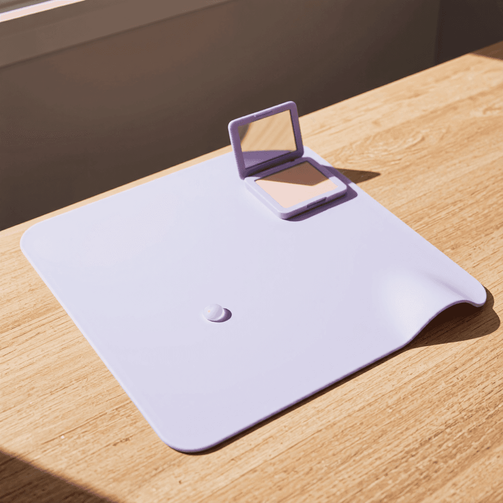 product photography of a silicone mat for kitchen use, designed to catch spills and protect surfaces