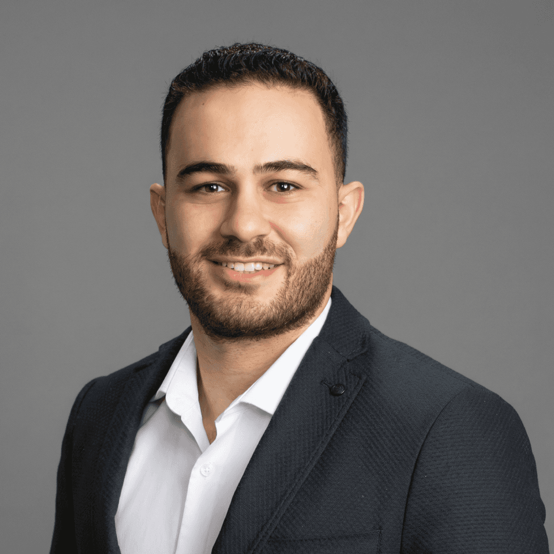 smiling woman in white and black checkered dress shirt