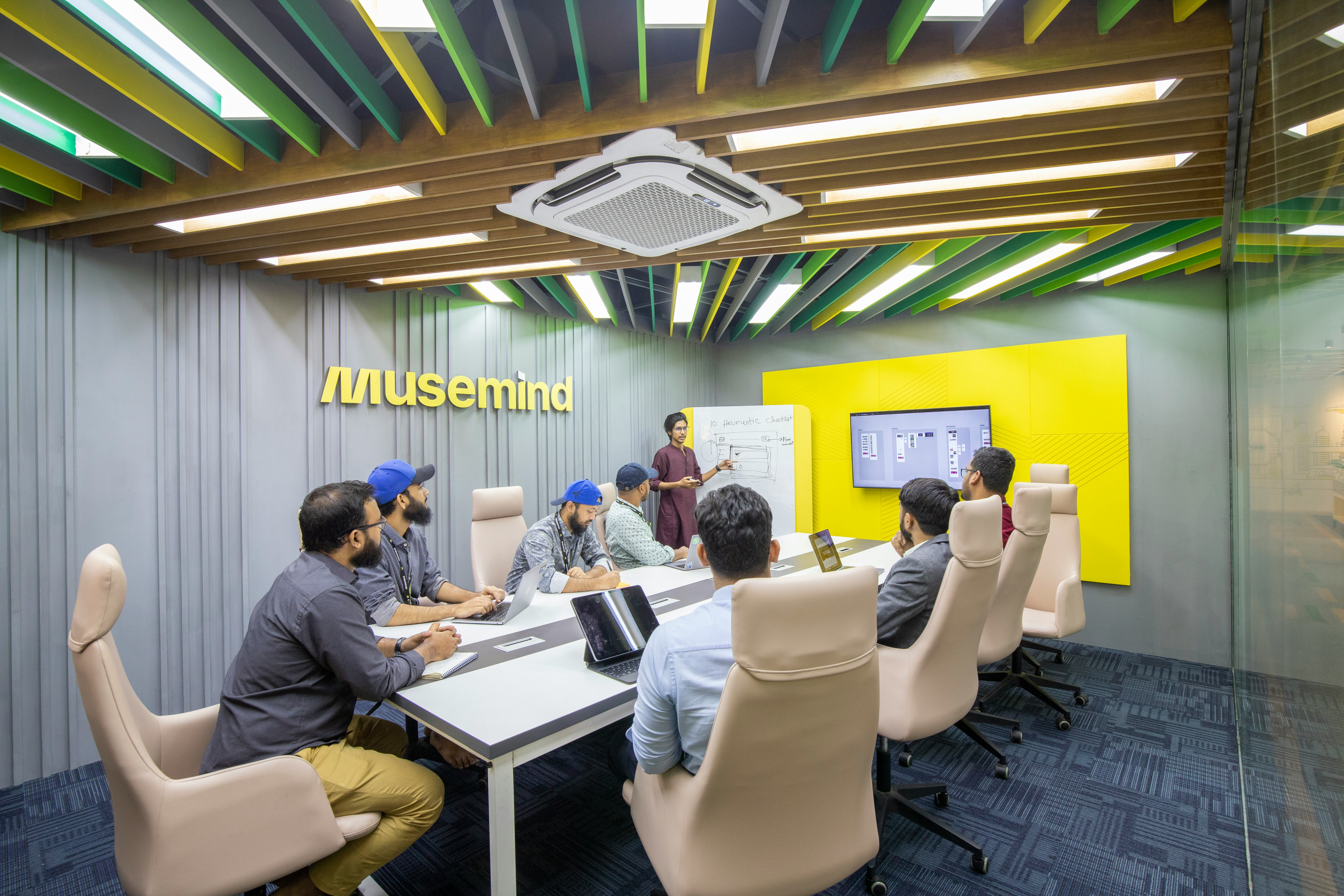 a group of people sitting around a conference table