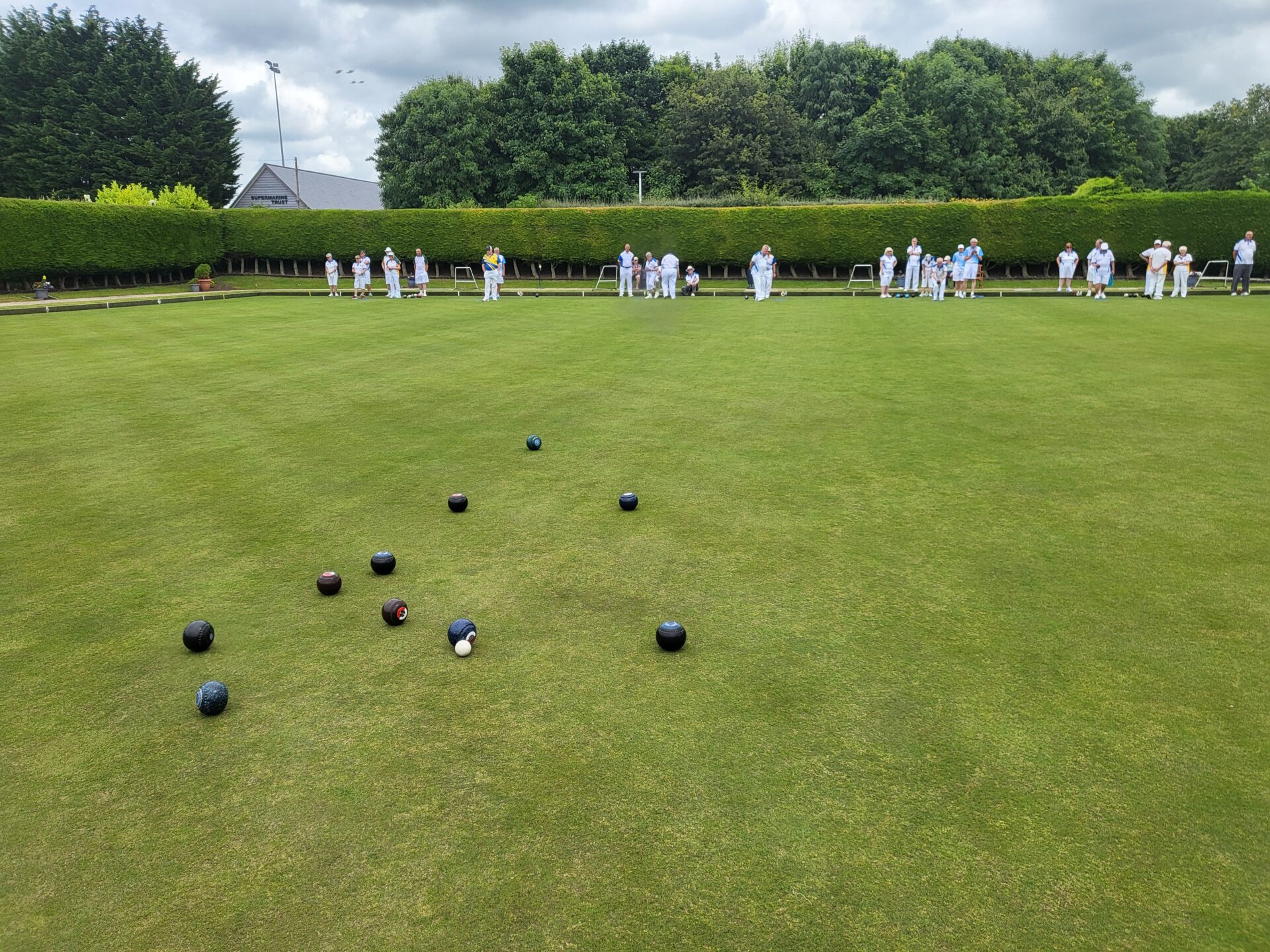 kids lying on a glass land and smiling