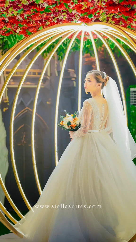 Bride inside the golden cage pavilion at Stalla Suites Events Place