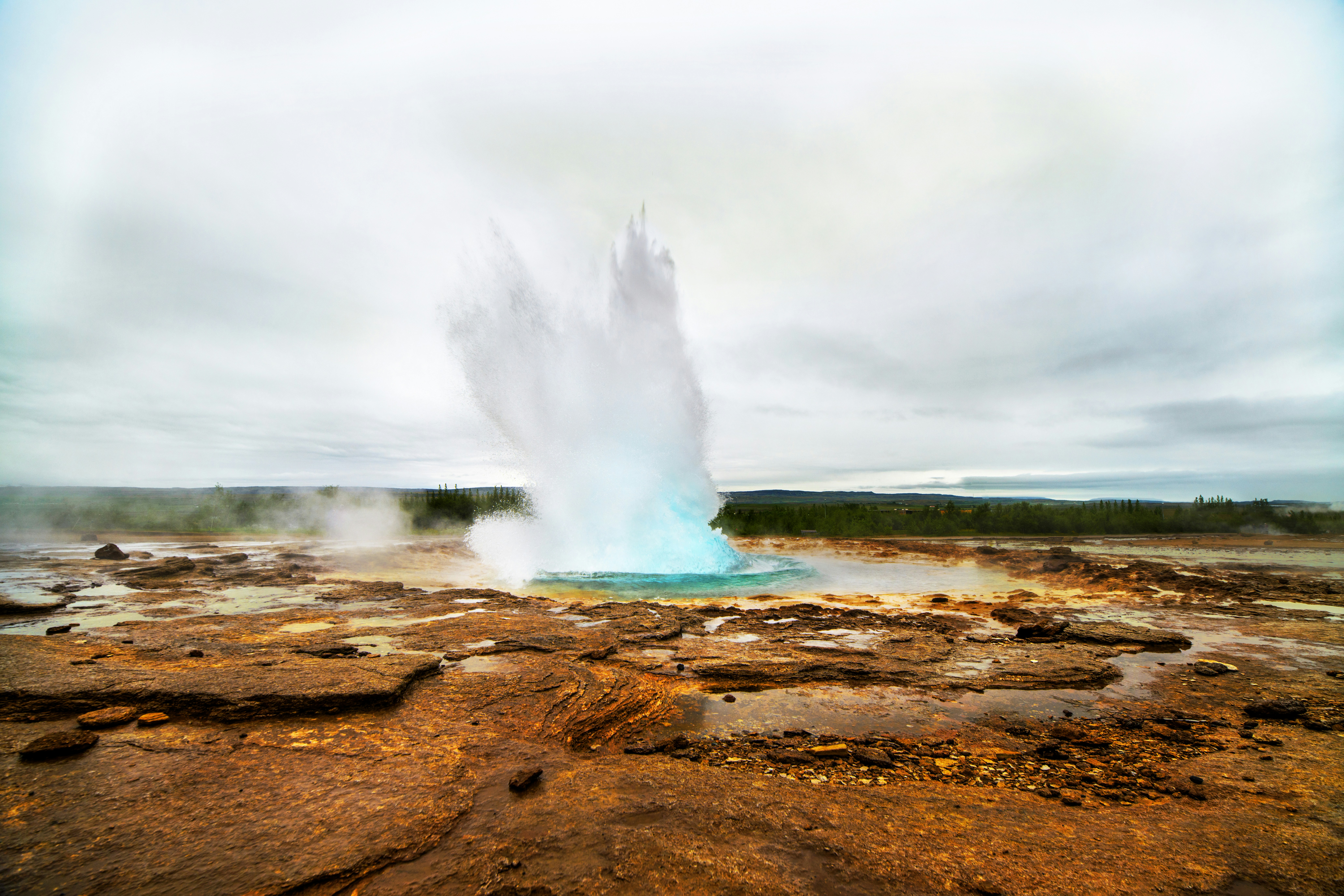Geyser shooting hot water along the Golden Circle in Iceland.
