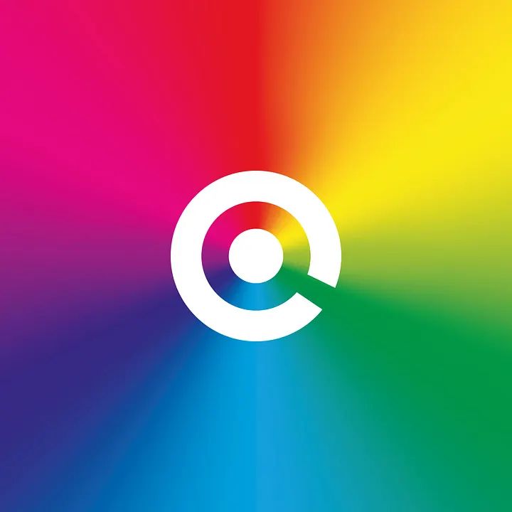 circular logo with a stylized letter "c" and a negative space magnifier, surrounded by vibrant rainbow colors blending outward.