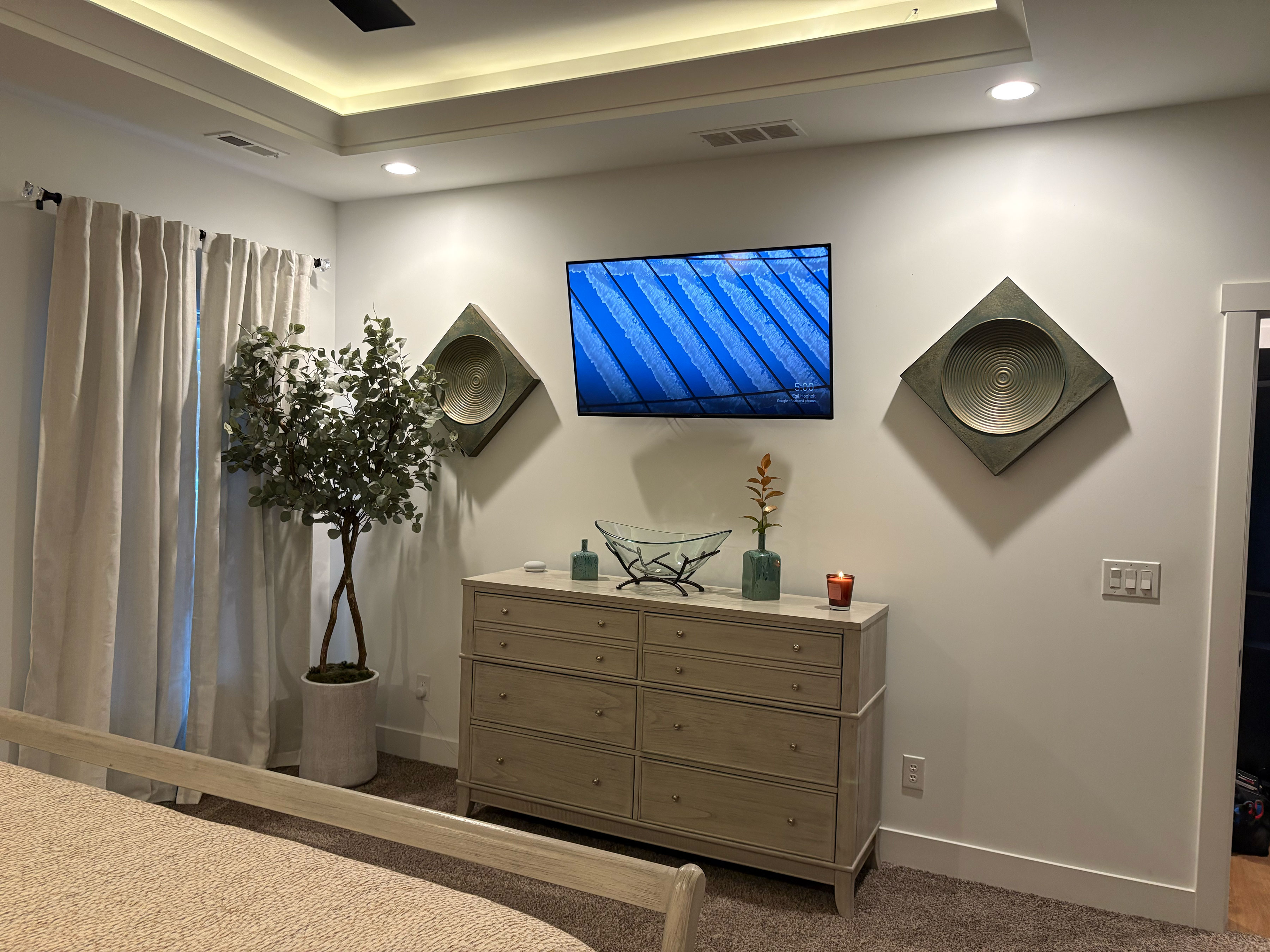 bedroom wall with TV mounted